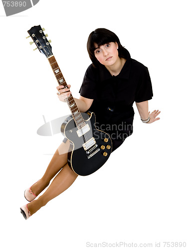 Image of Woman sitting with guitar