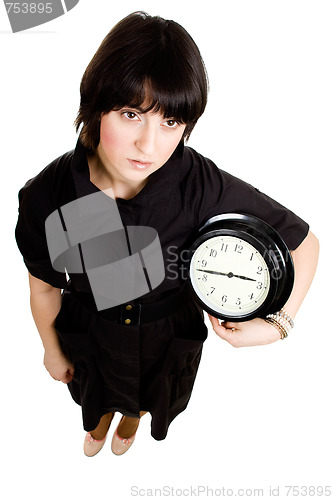 Image of Cacasian woman holding wall clock