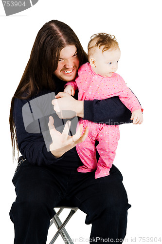 Image of Lovely child and fearful long hair rocker