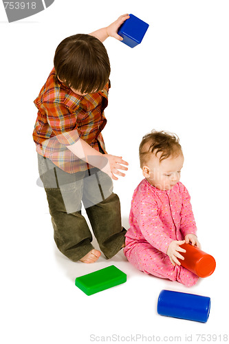 Image of Two kids playing colorfull blocks