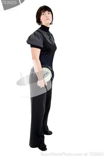 Image of Cacasian woman holding wall clock