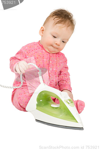 Image of Toddler playing with smoothing iron