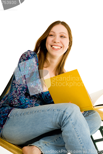 Image of Woman sitting with yellow book