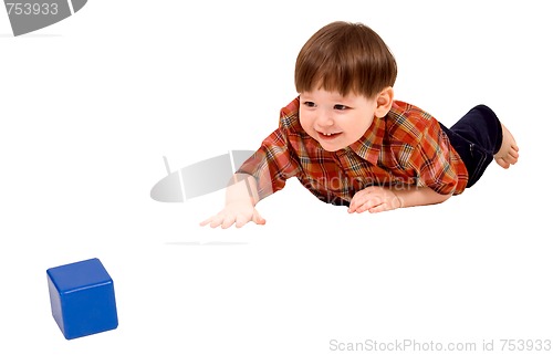 Image of Child stretching to toy