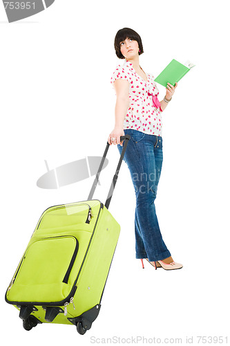 Image of traveler with suitcase and book