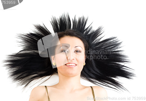 Image of Woman with long black hair calm and smiling