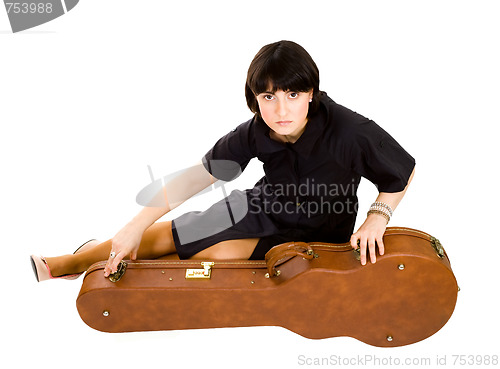 Image of Woman sitting with guitar case