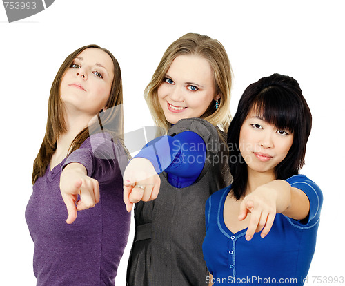 Image of Three women pointing at you