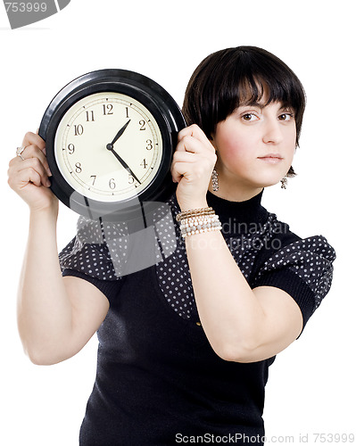 Image of Cacasian woman holding wall clock