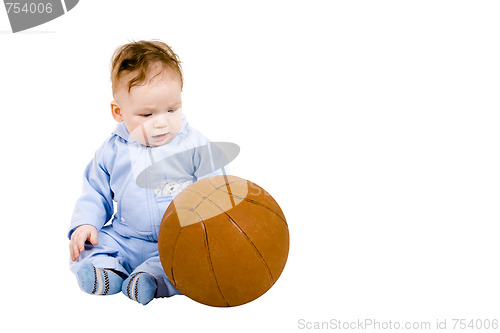 Image of Sad toddler with basketball ball