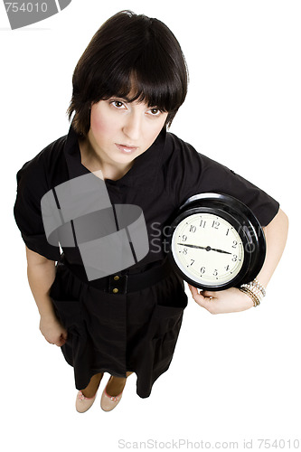 Image of Cacasian woman holding wall clock