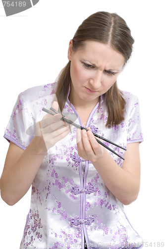 Image of Woman with chopsticks for sushi