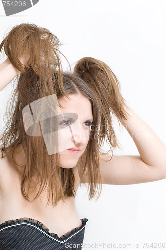 Image of Woman dissatisfied with her hair