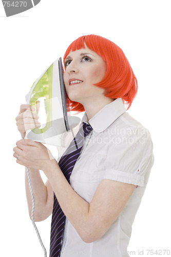 Image of Happy woman holding iron