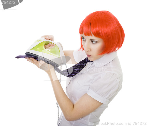 Image of woman ironing tie 