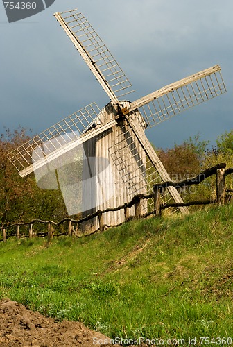 Image of Old windmill and wooden fence