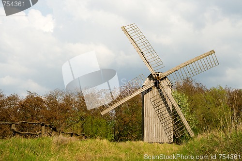 Image of Old windmill and wooden fence