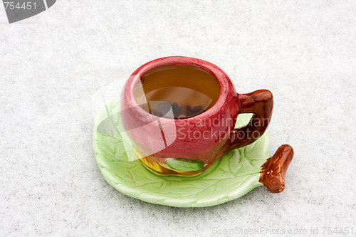 Image of A cup of tea on a snowy background