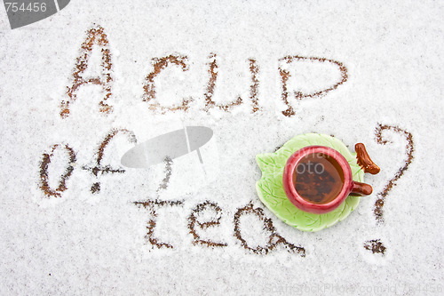 Image of A cup of tea on a snowy background