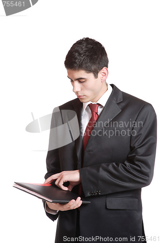 Image of Confident businessman with notebook