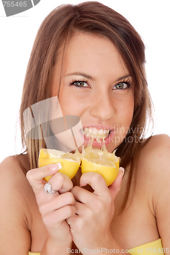 Image of happy model eating a Lemon