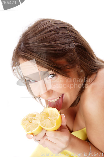 Image of happy model eating a Lemon