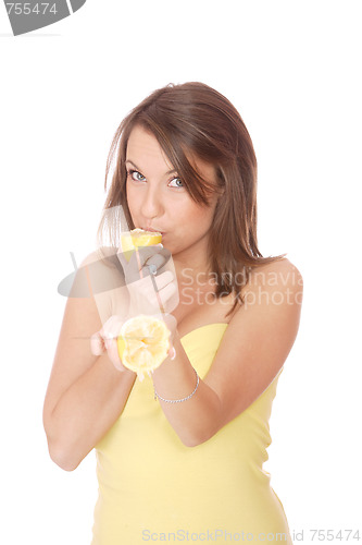 Image of happy model eating a Lemon