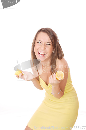 Image of happy model eating a Lemon