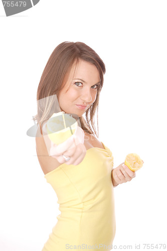 Image of happy model eating a Lemon