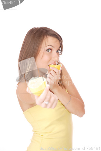 Image of happy model eating a Lemon
