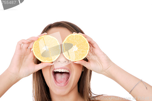 Image of happy model eating an orange