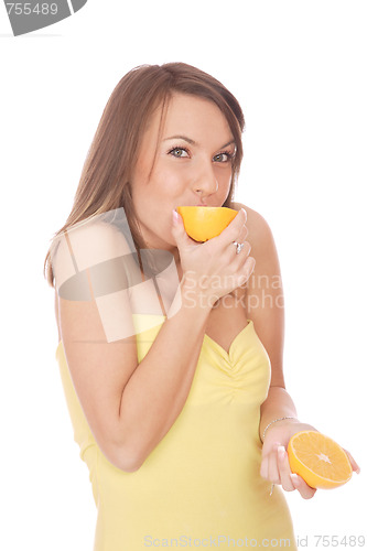 Image of happy model eating an orange