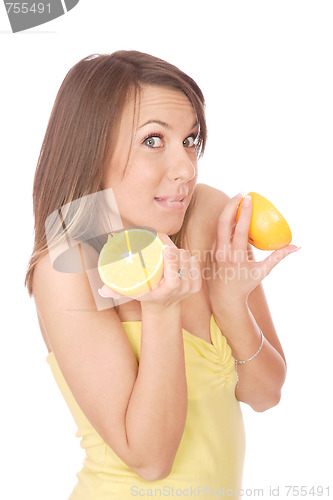 Image of happy model eating an orange