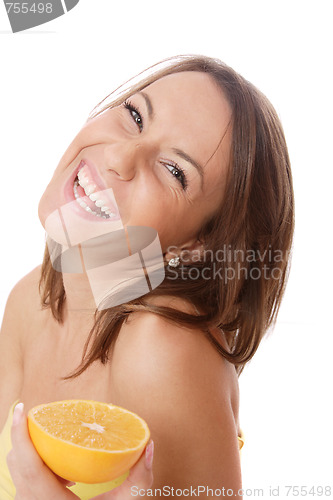Image of happy model eating an orange