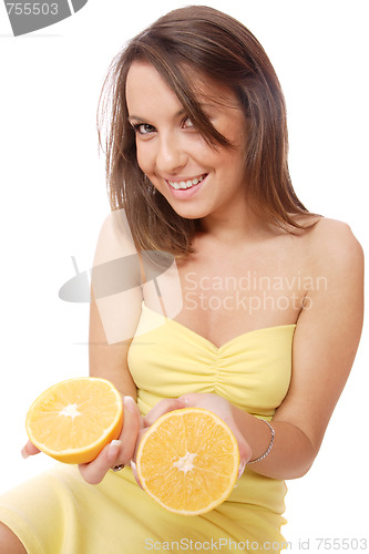 Image of happy model eating an orange