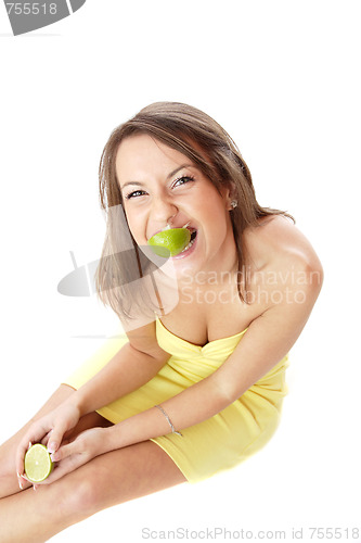 Image of happy model eating a Lemon