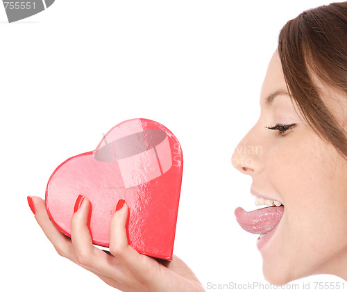 Image of Woman holding red heart in the hand