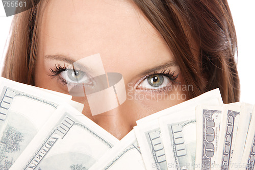 Image of Attractive woman takes lot of 100 dollar bills