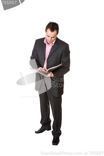 Image of Confident businessman with notebook