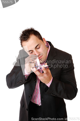 Image of Young man sniffing cocaine.