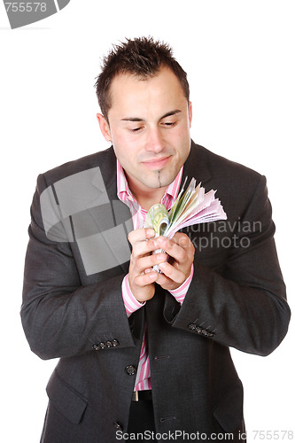 Image of Portrait of a business man holding money 