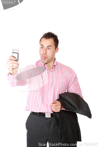 Image of Happy businessman holding laptop computer