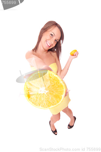 Image of happy model eating an orange