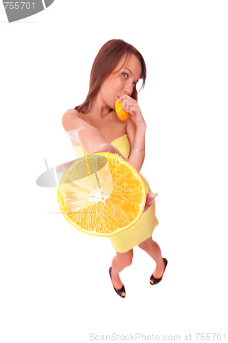 Image of happy model eating an orange