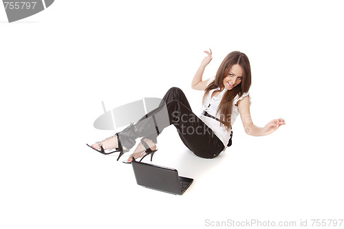 Image of casual woman with a laptop, working on the floor.