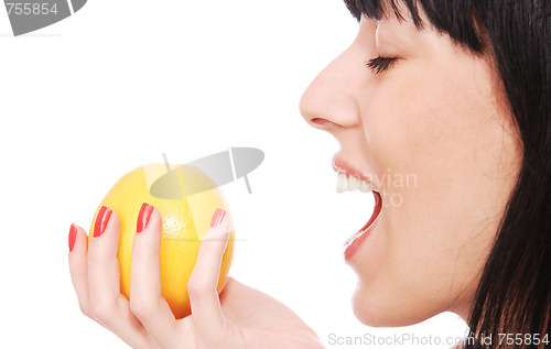 Image of A pretty young woman holding an apple 