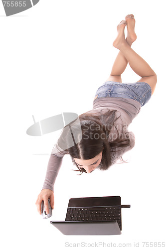 Image of casual woman with a laptop, working on the floor.