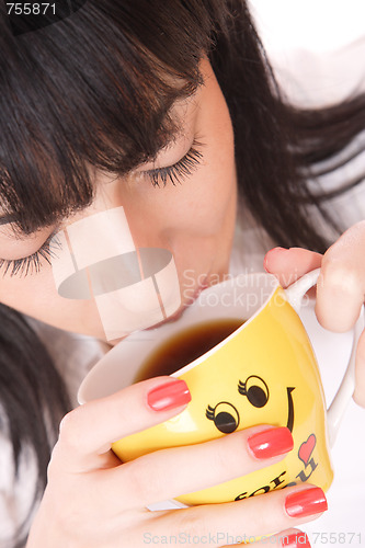 Image of Beautiful  business woman holding coffee cup.