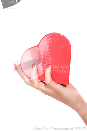 Image of Woman holding red heart in the hand