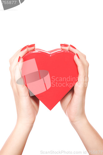 Image of Woman holding red heart in the hand